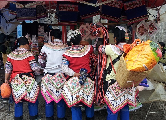 Yi women at a market